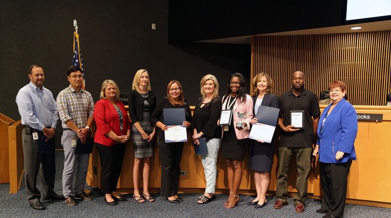 Gwinnett’s budget and communications staff along with Commission Chaariman Charlotte Nash receive awards for the Bicentennial Celebration website and four other at the National Association of County Information Officers awards competition in Nashville on July 15. Courtesy Gwinnett County