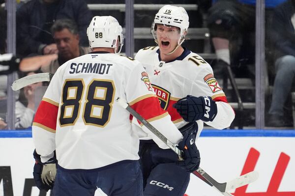 Florida Panthers center Anton Lundell (15) celebrates affter his goal with teammate Nate Schmidt (88) during the second period of Game 7 of a second-round NHL hockey playoff series against the Toronto Maple Leafsin Toronto, Sunday, May 18, 2025. (Frank Gunn/The Canadian Press via AP)