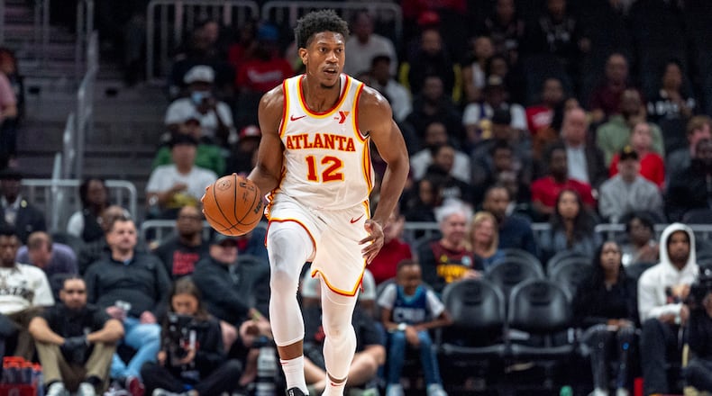 Atlanta Hawks forward De'Andre Hunter dribbles during the first half of an NBA basketball game against the Charlotte Hornets, Friday, Oct. 25, 2024, in Atlanta. (AP Photo/Jason Allen)