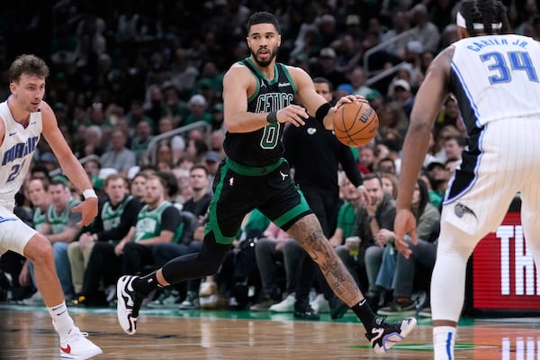 Boston Celtics forward Jayson Tatum (0) drives to the basket against the Orlando Magic during the second half in Game 5 of a first-round NBA playoff basketball series, Tuesday, April 29, 2025, in Boston. (AP Photo/Charles Krupa)