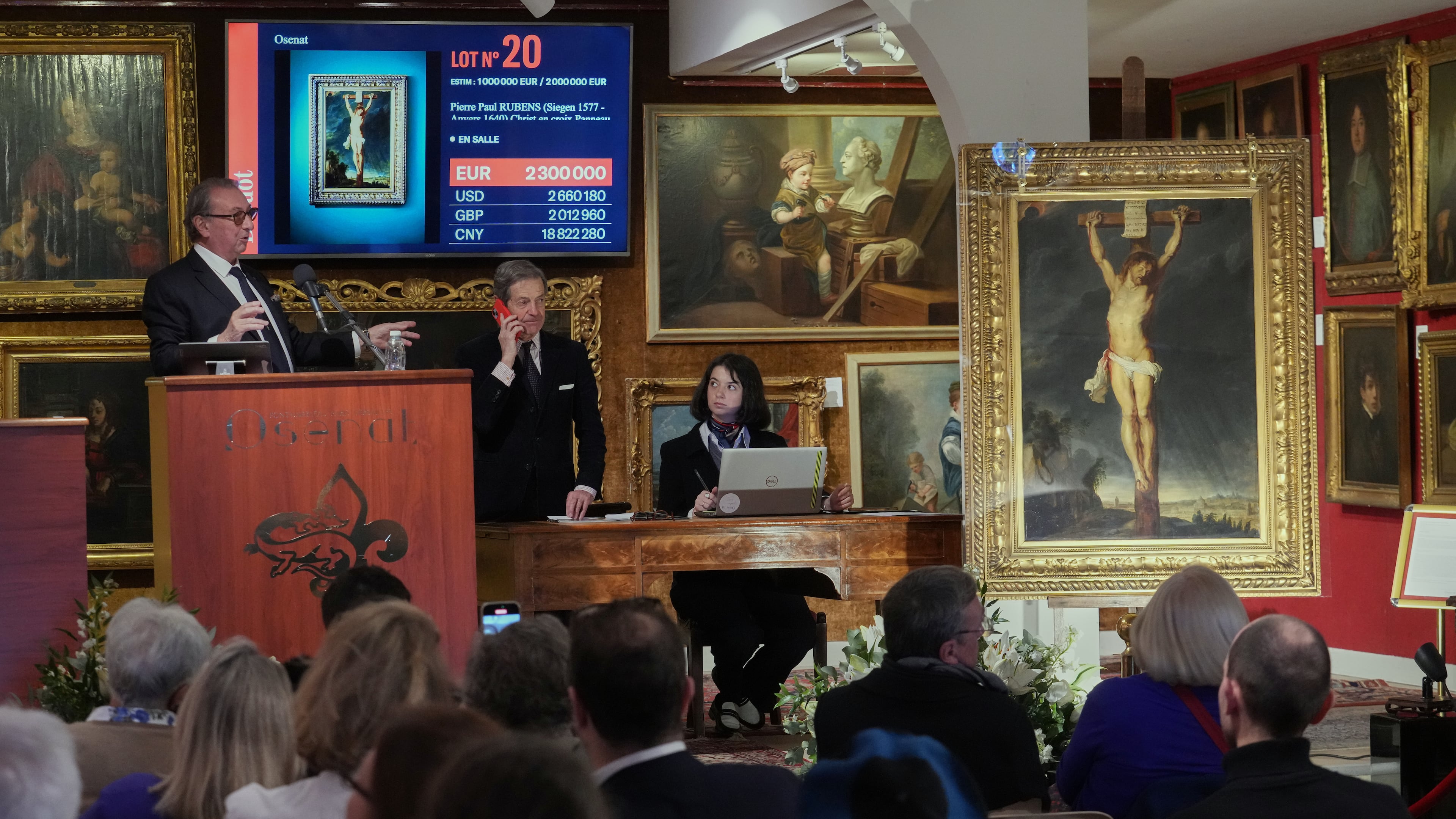 Auction officer Jean-Pierre Osenat gestures as the long-lost painting "Crucifixion of Jesus Christ" by Baroque master Peter Paul Rubens was sold at auction for 2,3 million euros or $2.66 million in Versailles, west of Paris, Nov. 30, 2025. (AP Photo/Michel Euler)