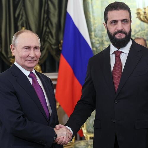 Russian President Vladimir Putin, left, and Syrian interim President Ahmad al-Sharaa pose for a photo during their meeting at the Grand Kremlin Palace in Moscow, on Wednesday, Jan. 28, 2026. (Maxim Shipenkov/Pool Photo via AP)
