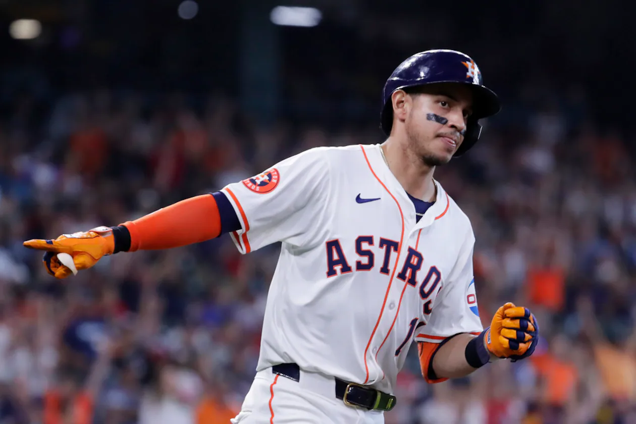 Houston Astros' Mauricio Dubon points to the dugout in celebration as he rounds the bases after hitting a home run against the Atlanta Braves during the sixth inning of a baseball game Wednesday, April 17, 2024, in Houston. (AP Photo/Michael Wyke)