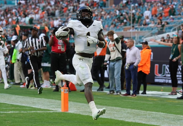 FILE - Wake Forest running back Demond Claiborne (1) runs back a kick return for a touchdown during the first half of an NCAA college football game against Miami, Saturday, Nov. 23, 2024, in Miami Gardens, Fla. (AP Photo/Lynne Sladky, File)