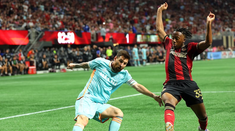 Inter Miami's Lionel Messi attempts to cross the ball against Atlanta United's Ajani Fortune (35) during the second half of the MLS Cup Playoffs at Mercedes-Benz Stadium on Saturday, Nov. 2, 2024, in Atlanta. (Kevin C. Cox/Getty Images/TNS)
