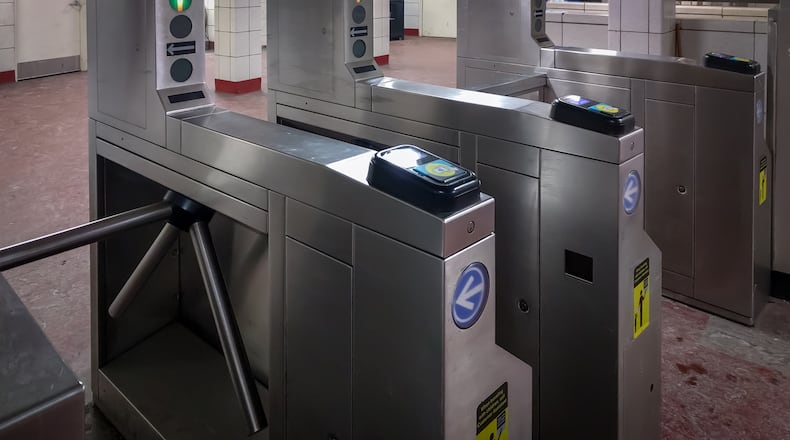 A transit turnstile in Chicago. Cubic Corp., which makes fare gates, back-office fare collection technology and other smart cities products for some of the world's largest mass transit agencies, is being acquired by two private equity firms in an all-cash deal valued at $2.8 billion. (Antwon McMullen/Dreamstime.com/TNS)