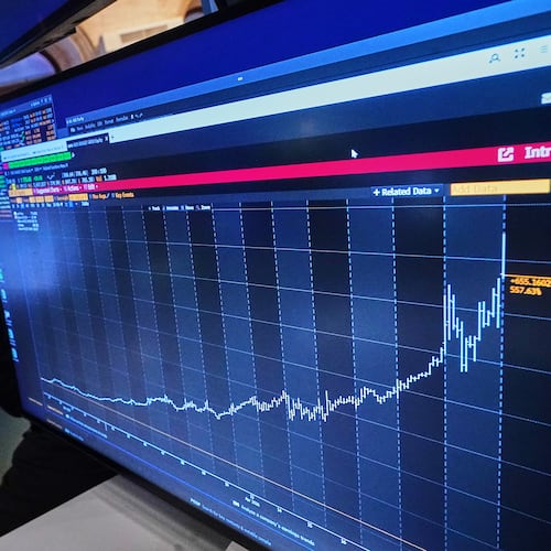 Specialist Meric Greenbaum works on the floor of the New York Stock Exchange, Wednesday, April 22, 2026. (AP Photo/Richard Drew)