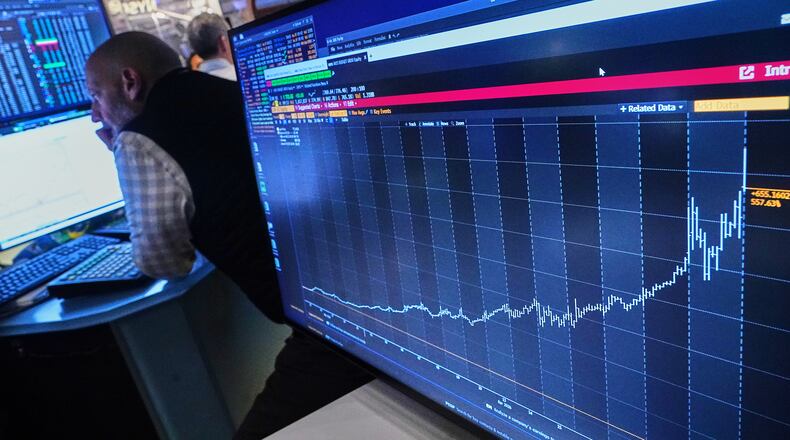 Specialist Meric Greenbaum works on the floor of the New York Stock Exchange, Wednesday, April 22, 2026. (AP Photo/Richard Drew)