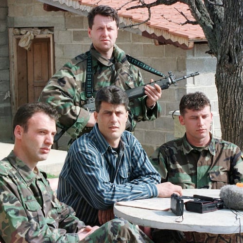 FILE - Hashim Thaci, head of the Kosovo Albanian negotiation team and head of the Kosovo Liberation Army political directorate, center, addresses a press conference in a secret location in central Kosovo, Saturday, March 13, 1999. (AP Photo/Visar Kryeziu, File)