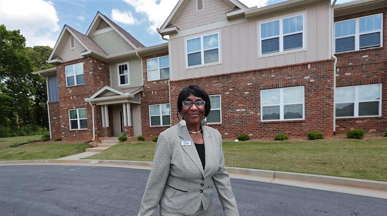 051721 LAWRENCEVILLE: Canary Gordon, 72, walks outside her new Thompson Square public housing unit on Monday, May 17, 2021, in Lawrenceville. “Curtis Compton / Curtis.Compton@ajc.com”