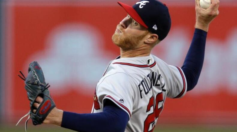 When Mike Foltynewicz took a no-hitter to the ninth inning Friday at Oakland, he and his Braves teammates were wearing red-billed caps instead of the all-navy variety the Braves have worn on the road since 2009. (AP photo)