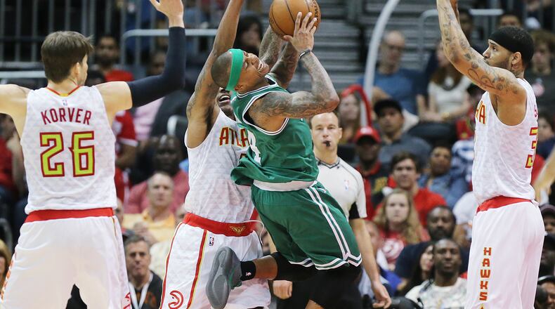 041916 ATLANTA: Hawks Kyle Korver (from left), jeff Teague, and Mike Scott triple team Celtics Isaiah Thomas stopping his drive to the basket in their NBA Eastern Conference first round playoff game at Philips Arena on Tuesday, April 19, 2016. Curtis Compton / ccompton@ajc.com