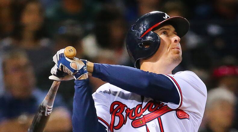 Braves’ Kelly Johnson hits a two-run homer to take a 4-1 lead against the Washington Nationals during the sixth inning on Monday, April 27, 2015, at Turner Field. (Curtis Compton / ccompton@ajc.com)