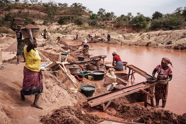 Women process gold at a mining site in the Kedougou region of Senegal on Thursday, Jan. 16, 2025. (AP Photo/Annika Hammerschlag)