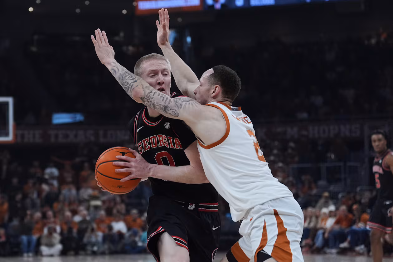 Georgia guard Blue Cain is pressured by Texas guard Chendall Weaver during the first half of an NCAA college basketball game in Austin, Texas, Saturday, Jan. 24, 2026. (Eric Gay/AP)