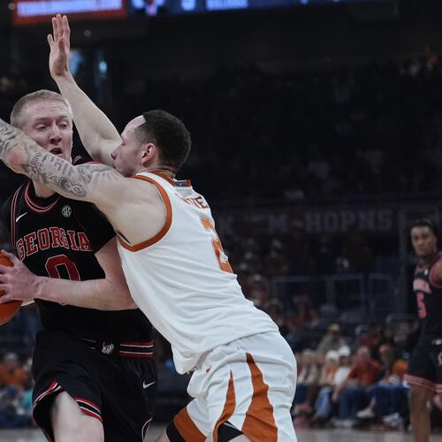 Georgia guard Blue Cain is pressured by Texas guard Chendall Weaver during the first half of an NCAA college basketball game in Austin, Texas, Saturday, Jan. 24, 2026. (Eric Gay/AP)