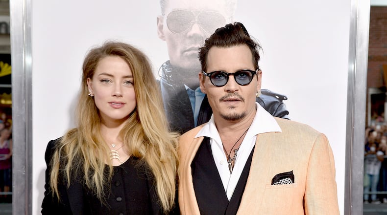 BOSTON, MA - SEPTEMBER 15: Actors Amber Heard (L) and Johnny Depp attend the "Black Mass" Boston special screening at the Coolidge Corner Theatre on September 15, 2015 in Boston, Massachusetts. (Photo by Paul Marotta/Getty Images for Warner Brothers)