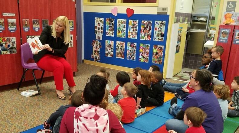 Georgia Department of Early Care and Learning Commissioner Amy M. Jacobs visits a licensed child care center at Georgia State University in 2018. She announced on Monday that Georgia is expanding its childcare subsidy.