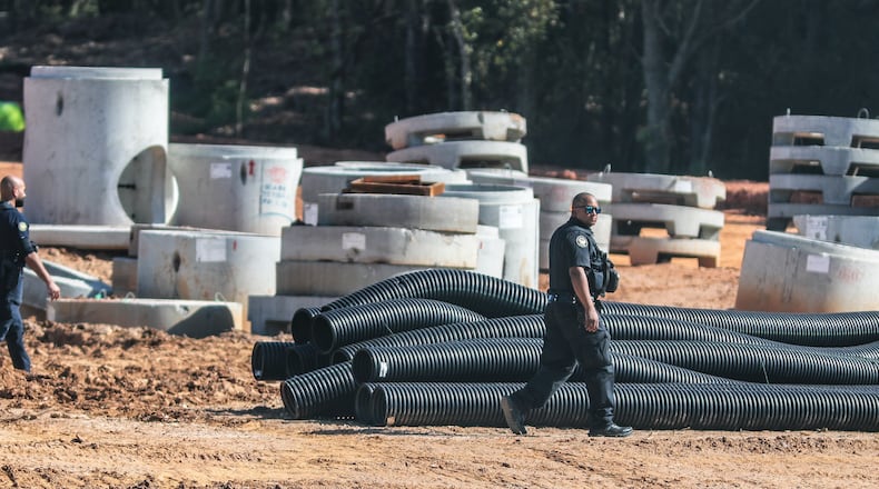 September 7, 2023 DeKalb County: Protesters gathered on Constitution Road after five individuals were arrested Thursday morning, Sept. 7, 2023 at the site of Atlanta’s proposed public safety training center after chaining themselves to construction equipment in an effort to halt work. According to the Atlanta Police Department, the training center opponents broke into the construction site off Constitution Road. “Those 5 people have been taken into custody and we are working with the Georgia Bureau of Investigation regarding charges on these individuals,” the department said in a statement. About two dozen protesters also lined the site in unincorporated DeKalb County, east of Atlanta, in opposition to the 85-acre facility. They chanted “Cop City will never be built” as law enforcement officers amassed. The crowd called the effort “the people’s injunction” to halt construction. “We have tried to get justice in the courts, we have tried to get justice using our politicians, and unfortunately, they have betrayed and failed us,” said Mary Hooks, with the activist group Movement for Black Lives. “So when our government systems fail, that is when the people must stand up and take action.” (John Spink / John.Spink@ajc.com)