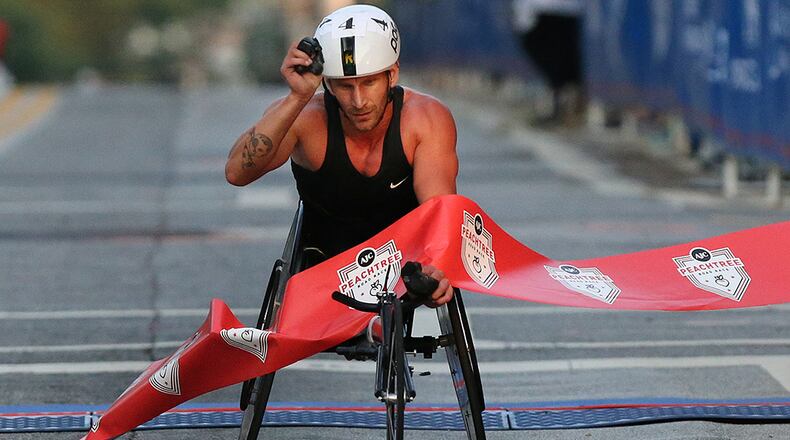 Josh George wins the men’s wheelchair division of the AJC Peachtree Road Race.