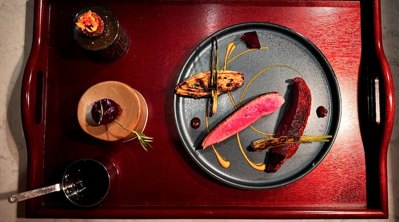 The hay-smoked duck at Avize, dry-aged for 10 days, is a labor of love. (Courtesy of Avize)