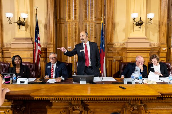 The ruling restricts Georgia Election Board member Janelle King, Executive Director Mike Coan, Chairman John Fervier, member Rick Jeffares, and member Janice Johnston from creating voting policies without the support of laws approved by the Georgia General Assembly. (Arvin Temkar / AJC)