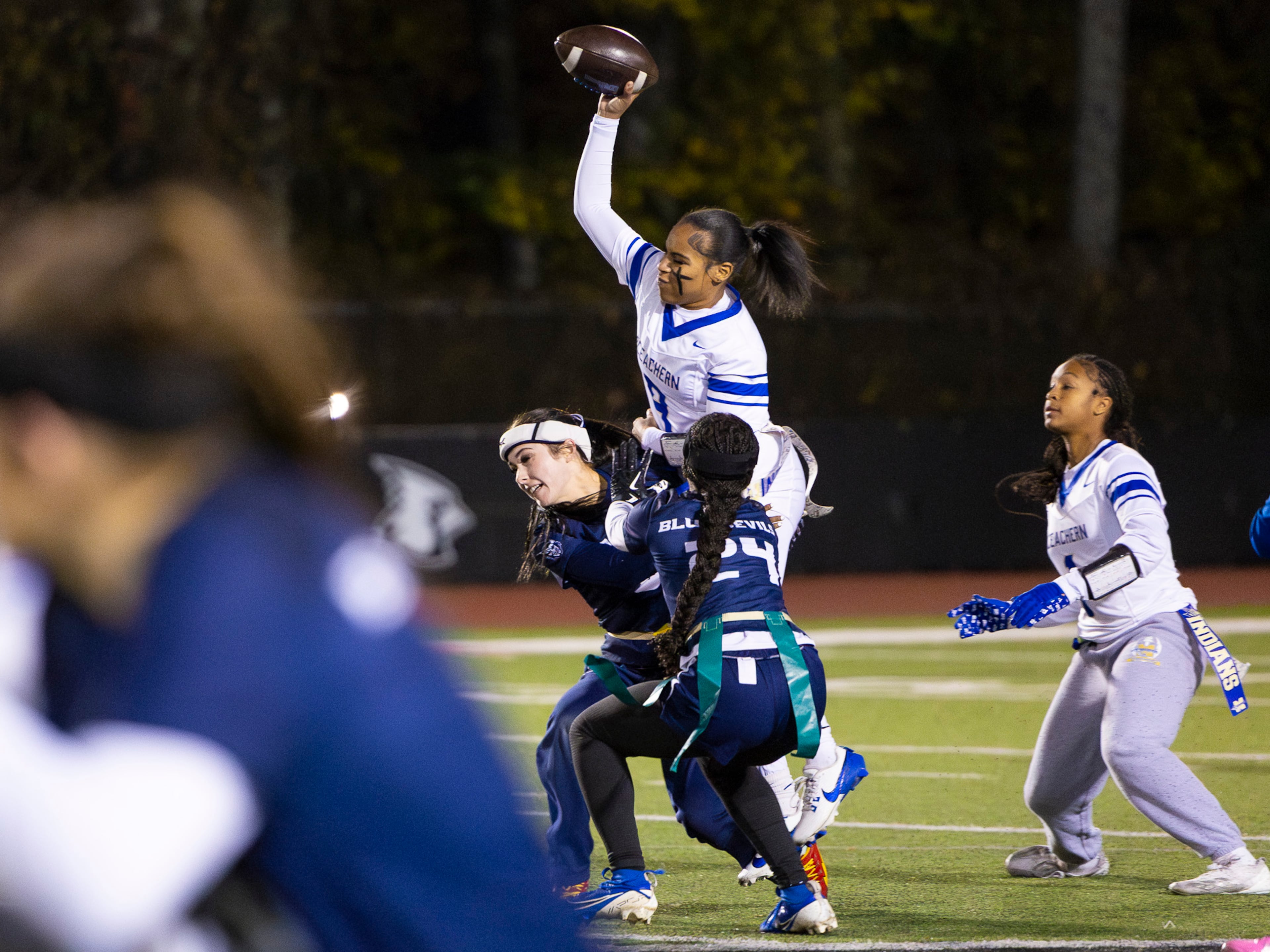 McEachern quarterback Ava George (center, white) gets her flag pulled in a flag football game against McEachern at Osborne High School in Marietta, GA on Monday, November 17th, 2025. (Oscar Guevara Saenz for the AJC)