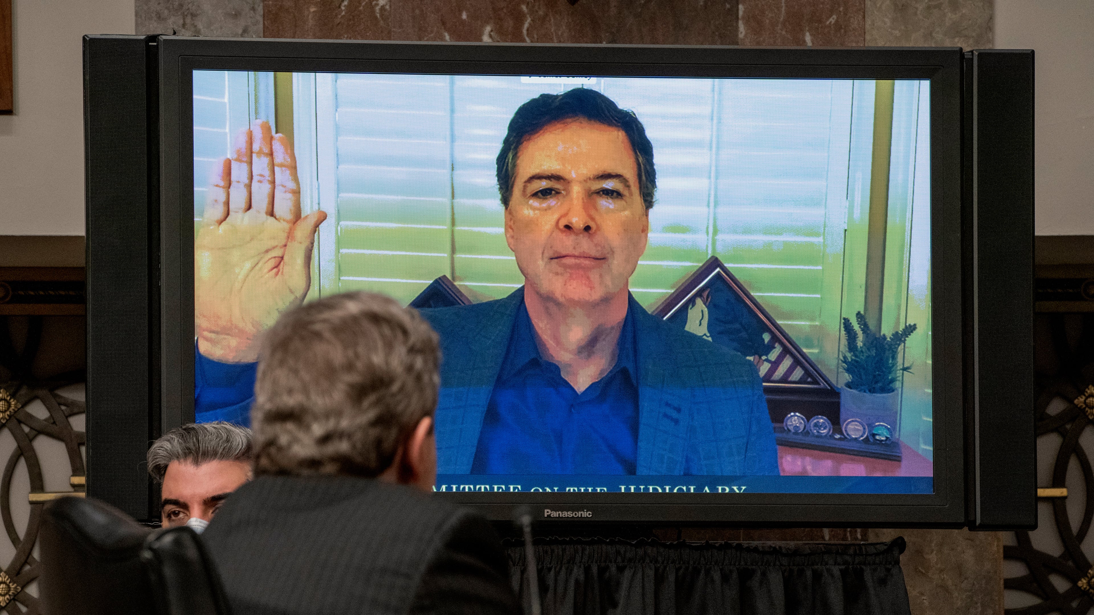 FILE - Former FBI director James Comey is sworn via videoconference before testifying during a Senate Judiciary Committee hearing on Capitol Hill in Washington, Wednesday, Sept. 30, 2020, to examine the FBI "Crossfire Hurricane" investigation. (Ken Cedeno/Pool via AP, File)