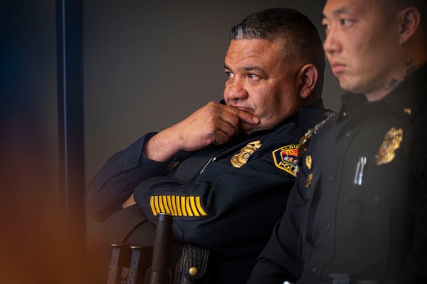 Albuquerque Police Chief Harold Medina listens to mayor Tim Keller speak at a press conference addressing the National Guard being deployed in Albuquerque, N.M., Tuesday, April 8, 2025. (Jessica Baca/The Albuquerque Journal via AP)