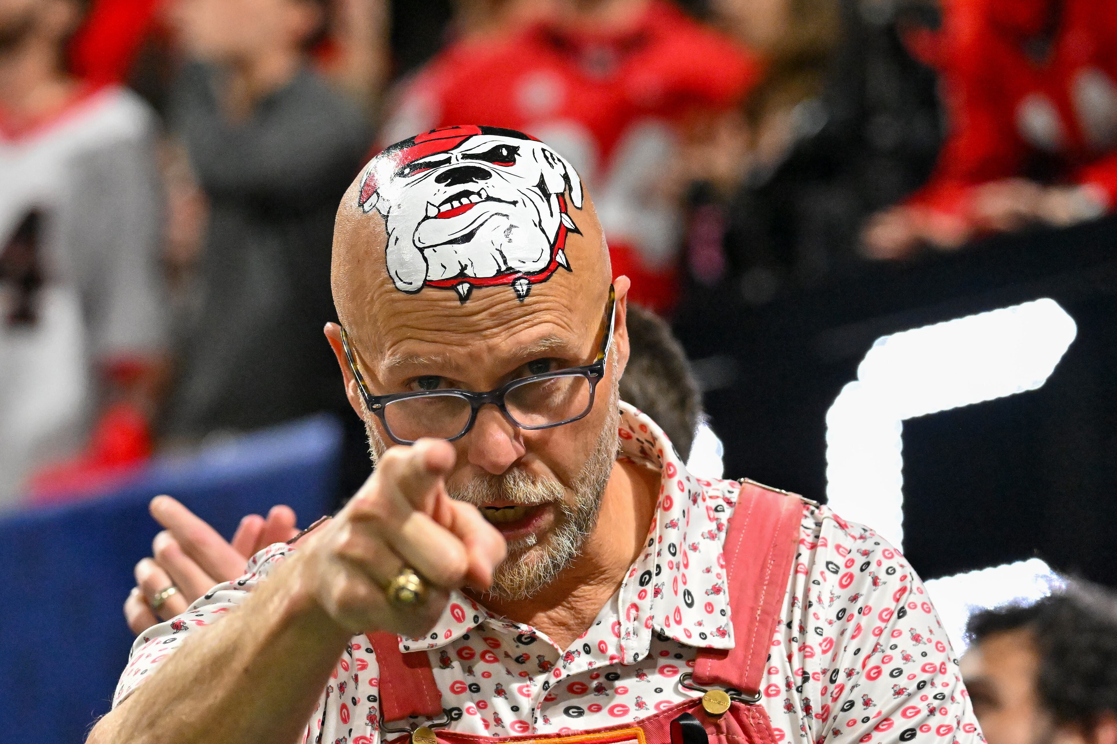 A Georgia fan reacts against Alabama during the fourth quarter of the SEC Championship game at Mercedes-Benz Stadium, Saturday, Dec. 6, 2025, in Atlanta. (Hyosub Shin / AJC)