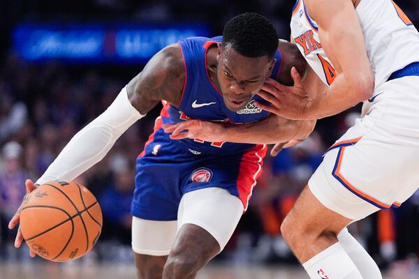 Detroit Pistons guard Dennis Schroder (17), left, moves past New York Knicks guard Pacome Dadiet (4), right, during the first half of Game 1 in an NBA basketball first-round playoff series, Saturday, April 19, 2025, in New York. (AP Photo/Julia Demaree Nikhinson)