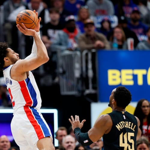 Detroit Pistons guard Cade Cunningham takes a shot against Cleveland Cavaliers guard Donovan Mitchell (45) during the first half in Game 2 of a second-round NBA playoffs basketball series, Thursday, May 7, 2026, in Detroit. (AP Photo/Duane Burleson)