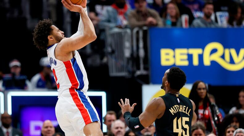 Detroit Pistons guard Cade Cunningham takes a shot against Cleveland Cavaliers guard Donovan Mitchell (45) during the first half in Game 2 of a second-round NBA playoffs basketball series, Thursday, May 7, 2026, in Detroit. (AP Photo/Duane Burleson)