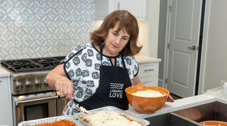Lynn Hirsch makes four pans of Lasagna in her Alpharetta home. She is the global outreach director for Lasagna Love. Hirsch and her husband Dr. Glenn Hirsch, a retired physician, make about four pans of lasagna each week and deliver them to neighbors who signed up to receive a meal from Lasagna Love. PHIL SKINNER FOR THE ATLANTA JOURNAL-CONSTITUTION