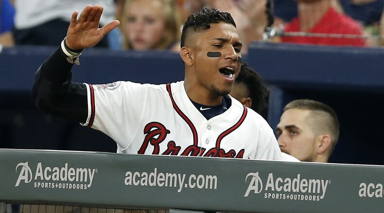 Shortstop Johan Camargo #17 of the Atlanta Braves celebrates after Lane Adams #16 (not pictured) scores in the seventh inning during the game against the Miami Marlins at SunTrust Park on August 4, 2017 in Atlanta, Georgia. (Photo by Mike Zarrilli/Getty Images)