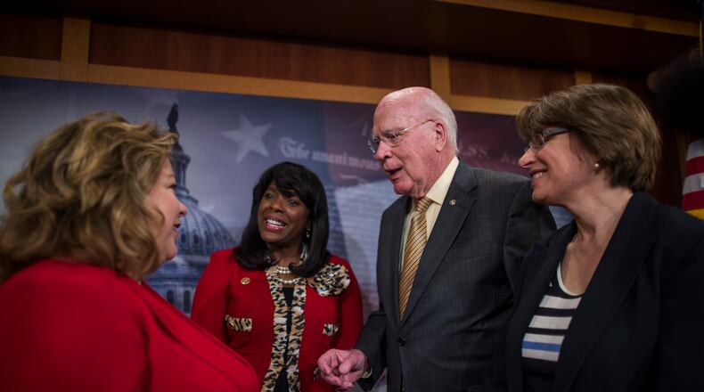From left: Rep. Linda Sanchez (D-Calif.), Rep. Terri Sewell (D-Ala.), Sen. Patrick Leahy (D-Vt.), and Sen. Amy Klobuchar (D-Minn.) talk after a news conference discussing bicameral voting rights legislation on Capitol Hill. (Zach Gibson/The New York Times)