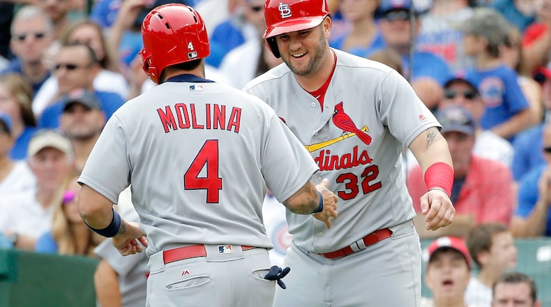 Matt Adams (right) in 2016, when he was 30 pounds heavier. (Photo by Jon Durr/Getty Images)
