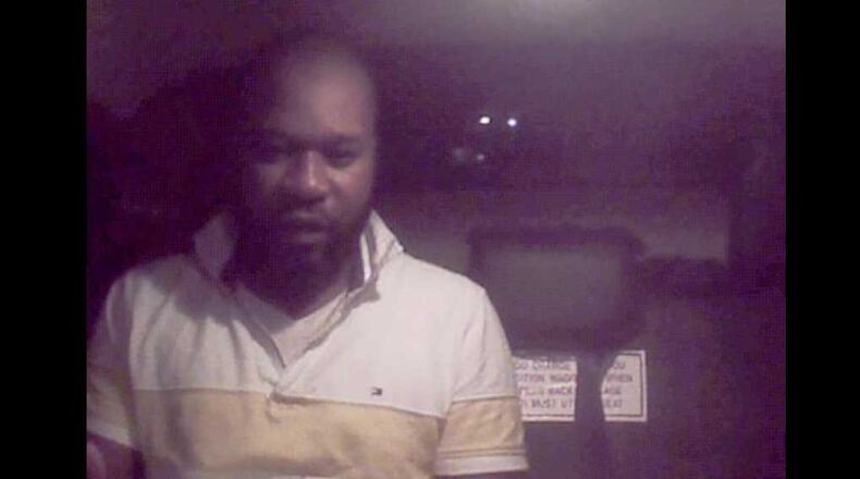 Police are looking to identify this man, who is accused of robbing a taxi driver in Dunwoody.
