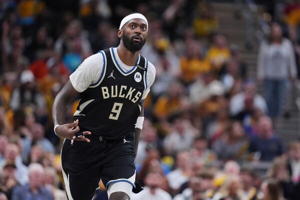 Milwaukee Bucks forward Bobby Portis (9) gestures after a basket during the second half of a first-round NBA basketball playoff game in Indianapolis, Tuesday, April 22, 2025. (AP Photo/Michael Conroy)