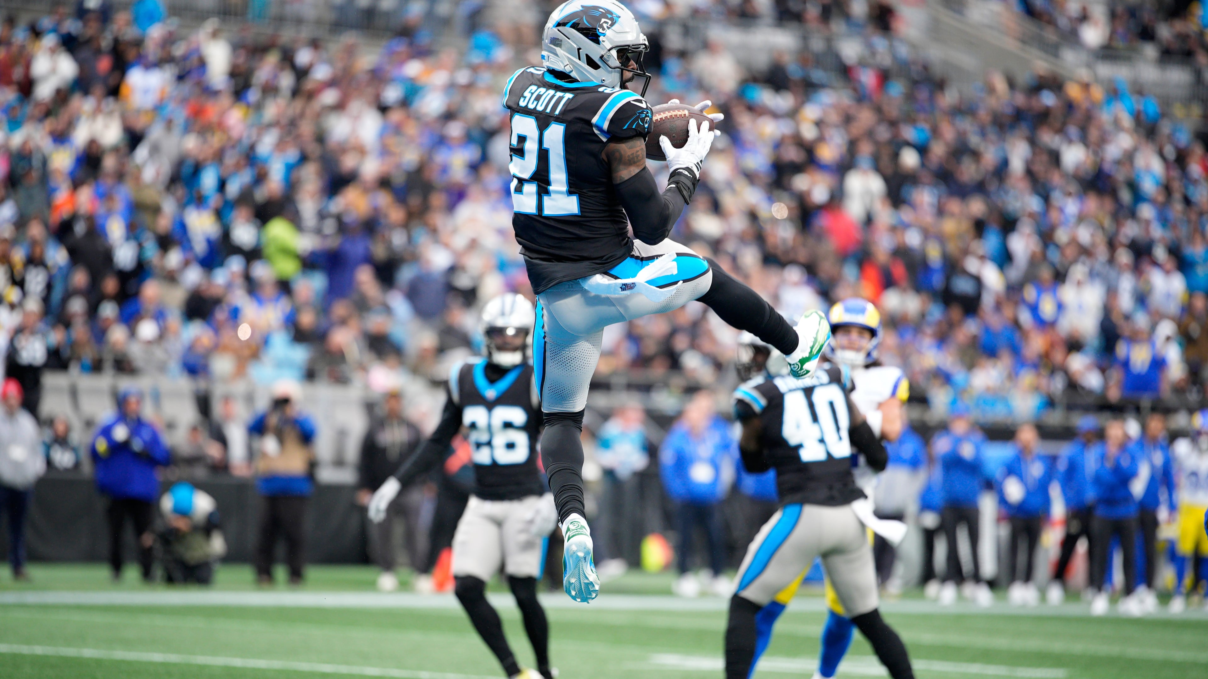 Carolina Panthers safety Nick Scott intercepts of pass against the Los Angeles Rams during the first half of an NFL football game, Sunday, Nov. 30, 2025, in Charlotte, N.C. (AP Photo/Jacob Kupferman)