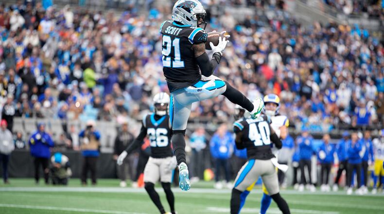 Carolina Panthers safety Nick Scott intercepts of pass against the Los Angeles Rams during the first half of an NFL football game, Sunday, Nov. 30, 2025, in Charlotte, N.C. (AP Photo/Jacob Kupferman)