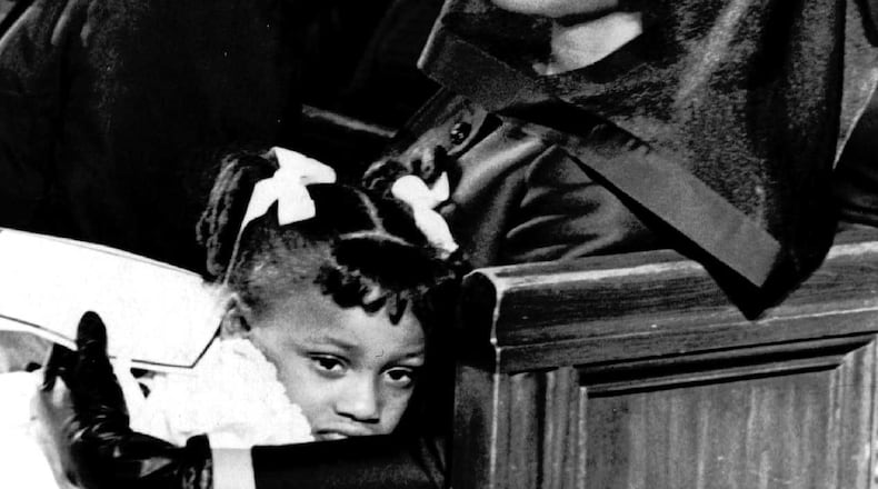 Coretta Scott King and her daughter Bernice, 5, are shown April 9, 1968, attending the funeral of her husband, Dr. Martin Luther King, Jr., in Atlanta, in this Pulitzer-prize winning file photograph taken by Moneta J. Sleet, Jr., the first African-American to win a Pulitzer Prize for photography. (AP Photo/Moneta J. Sleet, Jr.)