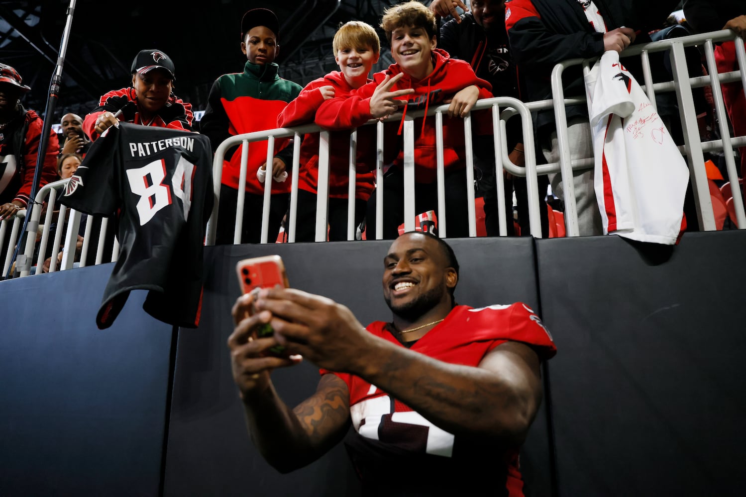 Falcons running back Cordarrelle Patterson takes a selfie with fans after Atlanta defeated the Bears 27-24 on Sunday at Mercedes-Benz Stadium. (Miguel Martinez / miguel.martinezjimenez@ajc.com)