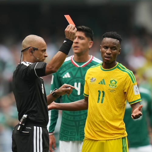 Referee Wilton Sampaio, of Brazil, show the red card to South Africa's Themba Zwane during the World Cup Group A soccer match between Mexico and South Africa in Mexico City, Thursday, June 11, 2026. (AP Photo/Silvia Izquierdo)