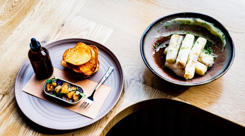 Chilled Mussels en Escabeche (left) and Crispy Eggplant are great ways to start a meal at Redbird. CONTRIBUTED BY HENRI HOLLIS