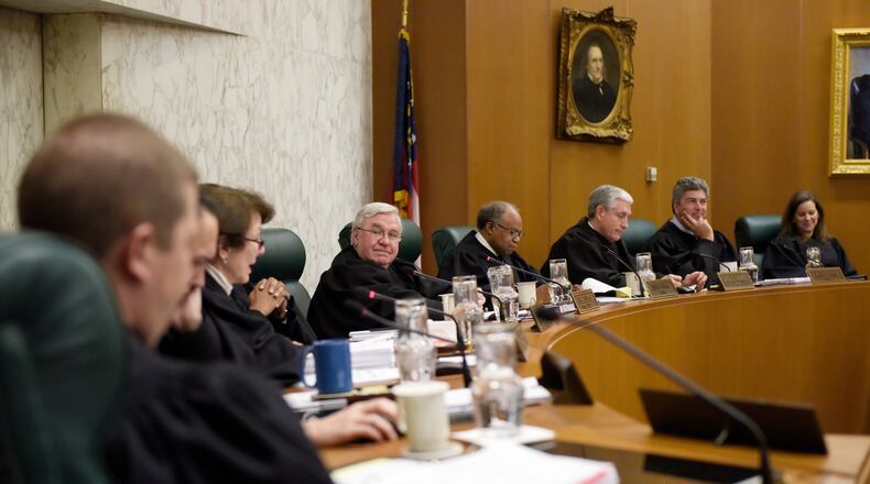 In this January file photo, all nine justices meet at the Georgia Supreme Court for oral arguments in Atlanta. DAVID BARNES / DAVID.BARNES@AJC.COM)