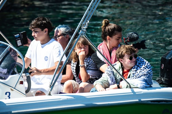 Climate activist Greta Thunberg, center, waits to board the Madleen boat, before setting sail for Gaza along with activists of the Freedom Flotilla Coalition, departing from the Sicilian port of Catania, Italy, Sunday, June 1, 2025. (AP Photo/Salvatore Cavalli)