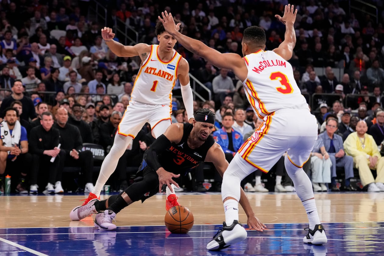 The Hawks’ defense, powered by Jalen Johnson (back) and CJ McCollum, picked up in the fourth quarter, allowing Atlanta to overcome a double-digit deficit in their Game 2 win over the Knicks on Monday, April 20, 2026, at Madison Square Garden in New York. (Yuki Iwamura/AP)