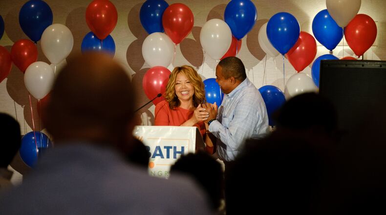 U.S. Rep. Lucy McBath celebrates with her husband, Curtis McBath, after winning the 7th Congressional District primary in May. Her race against a fellow member of the U.S. House, U.S. Rep. Carolyn Bourdeaux, was seen as a proxy fight between the party's liberal and centrist wings. Nabilah Islam, a Gwinnett County liberal who also won a primary fight for a state Senate seat, called McBath's win a "mandate." Islam called McBath’s election “a mandate.” “The voters in Gwinnett County said resoundingly they want progressive representation,” Islam said. (Arvin Temkar / arvin.temkar@ajc.com)