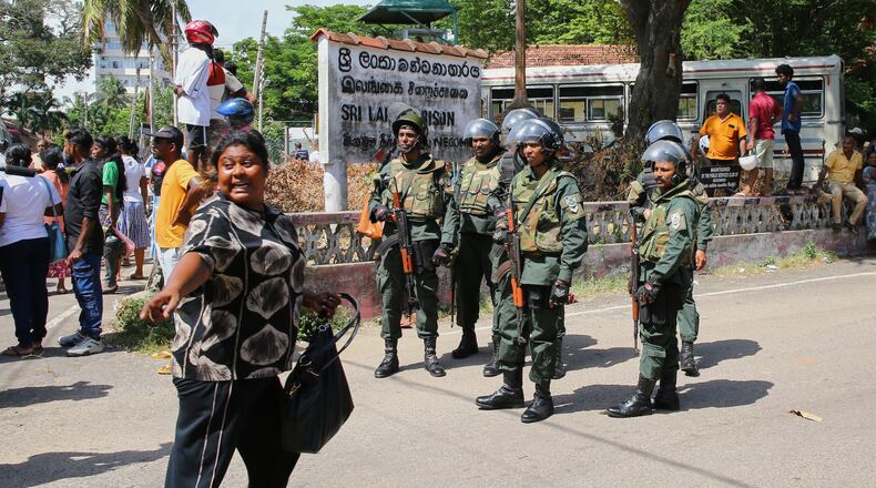 Security personnel stand guard outside a prison where deadly clashes broke out on Sunday, in Negombo, 35 kilometers (22 miles) north of the capital Colombo, Sri Lanka, Monday, July 6, 2026. (AP Photo)